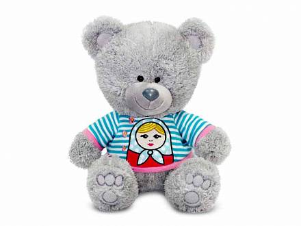 Мягкая игрушка - Медвежонок Ники в футболке с матрешкой, музыкальный, 21,5 см 